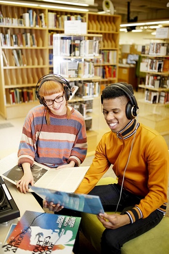 young people listening to music with headphones